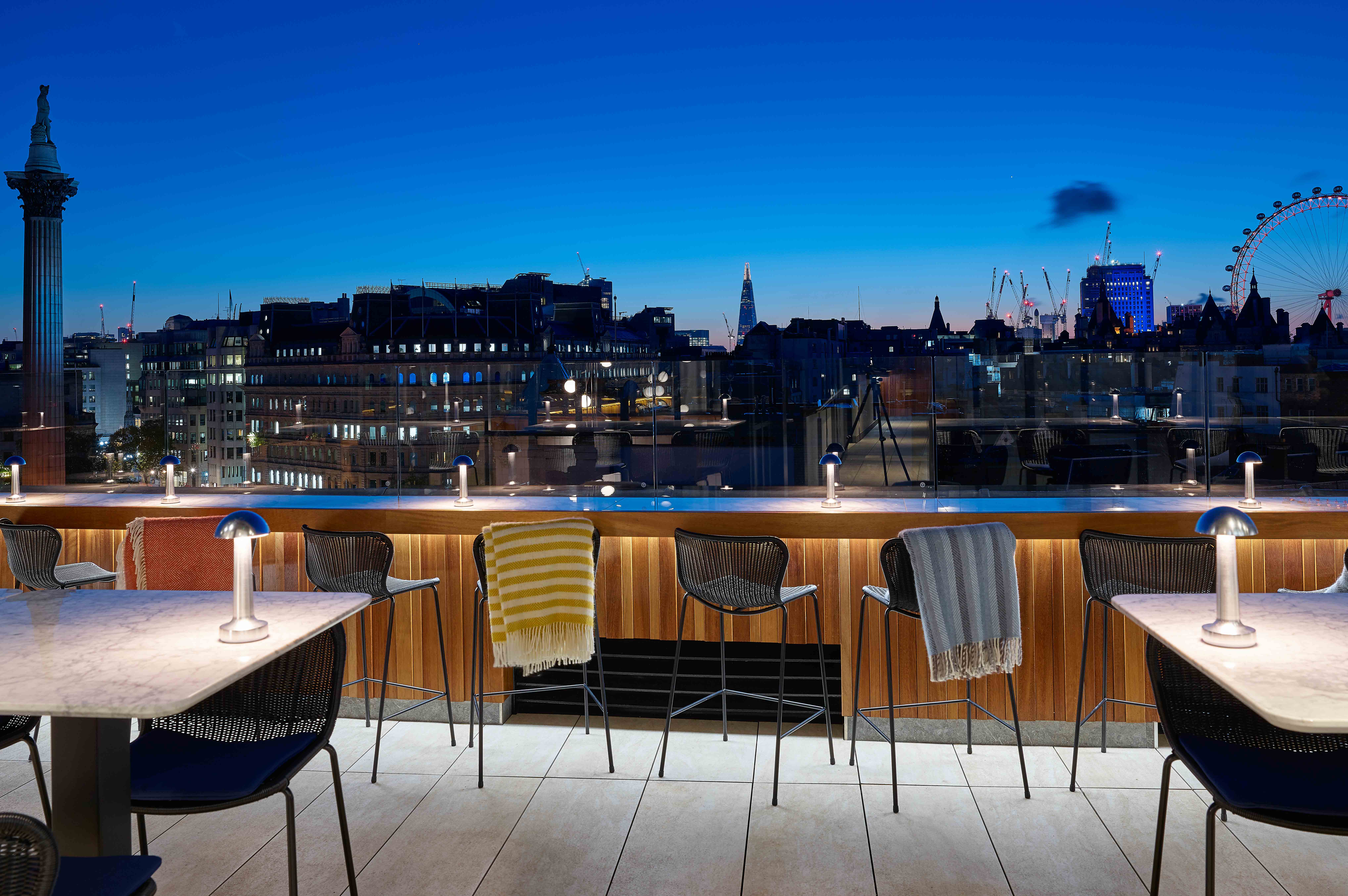Rooftop Gallery at Trafalgar St James with city skyline for evening events and receptions.