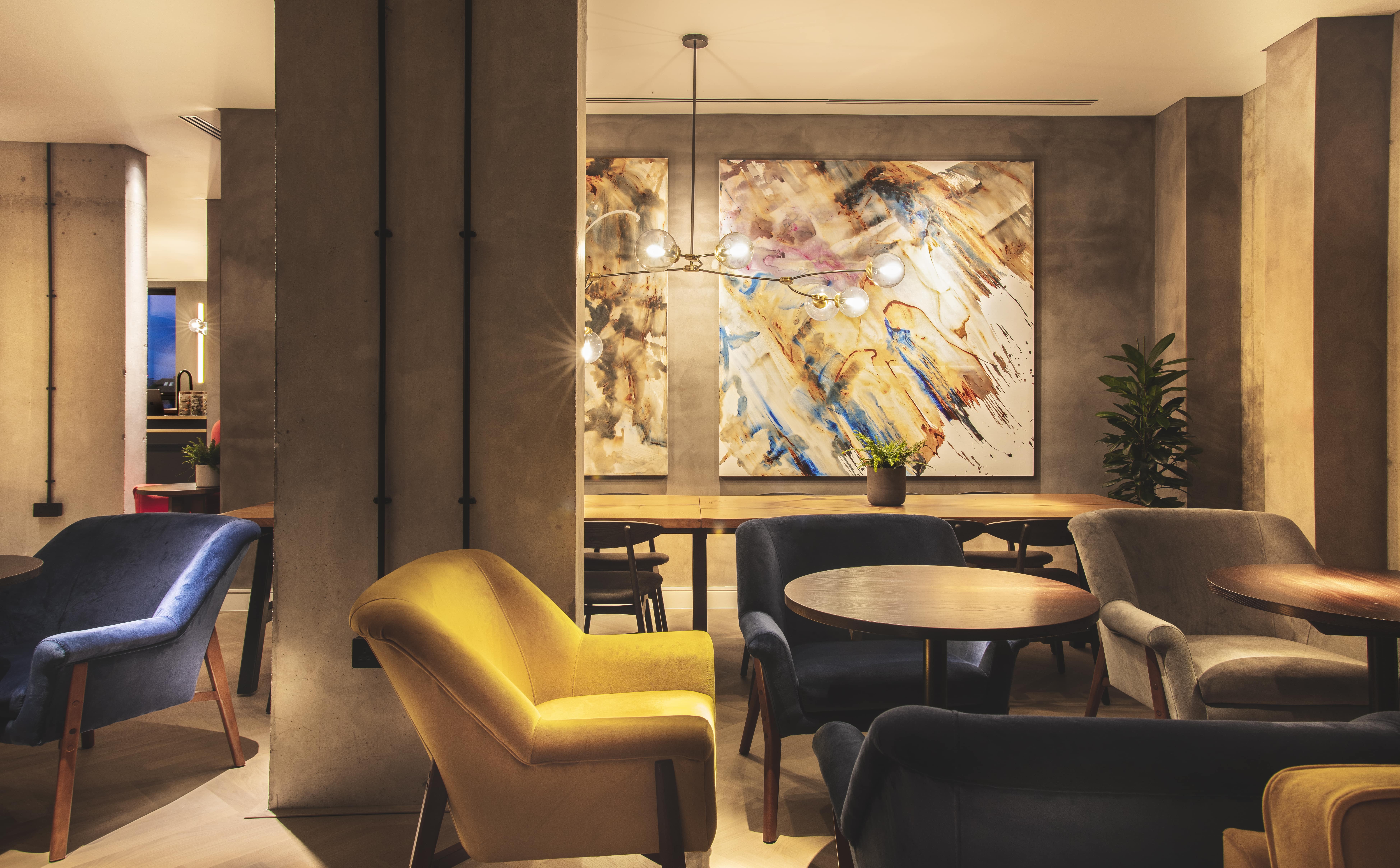 Modern meeting space with artistic decor at The Gate Aparthotel Aldgate East.