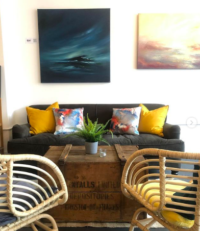 Cozy lounge area with vibrant cushions for networking events and casual meetings.