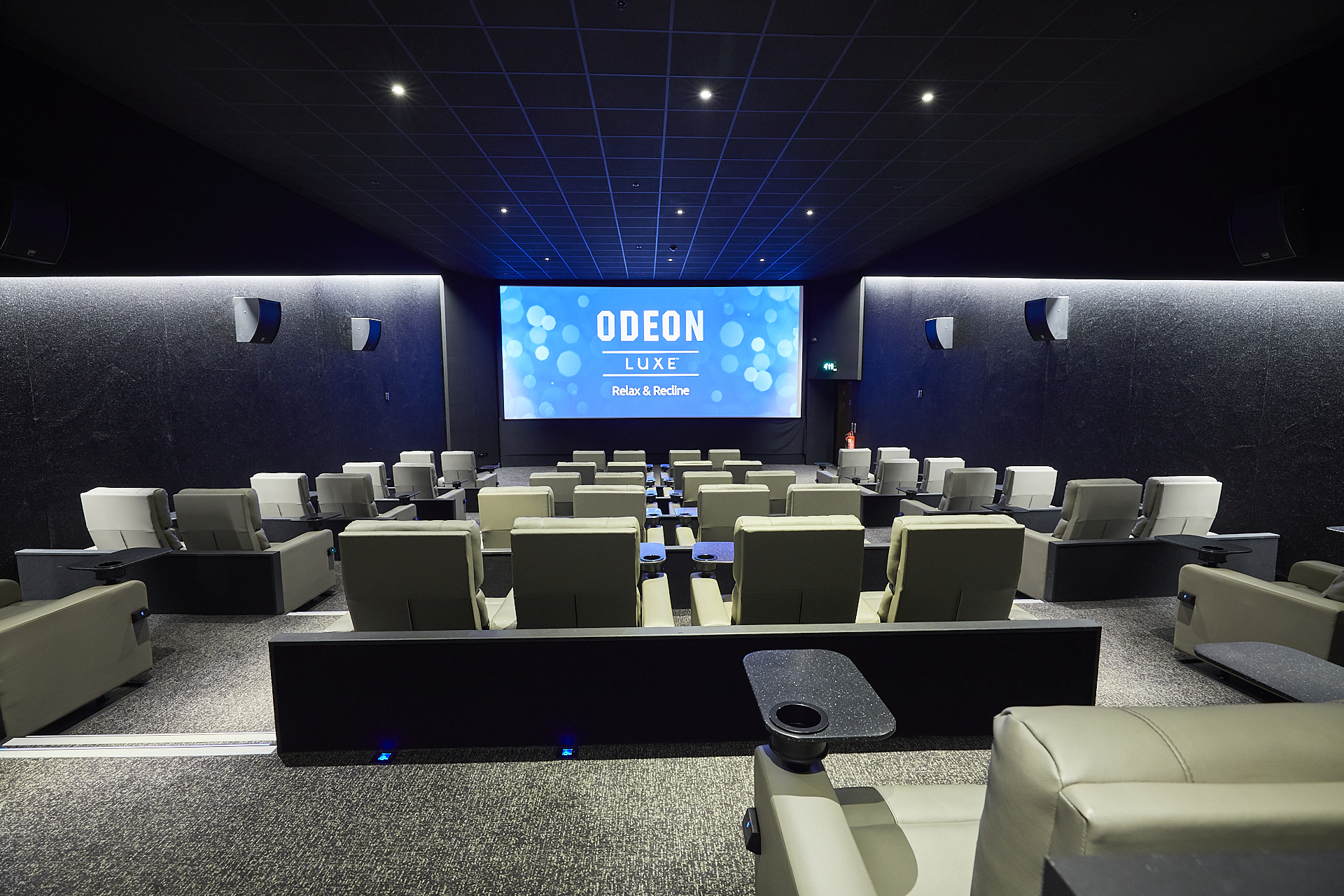 Modern cinema with plush seating and large screen for premium events in Islington.