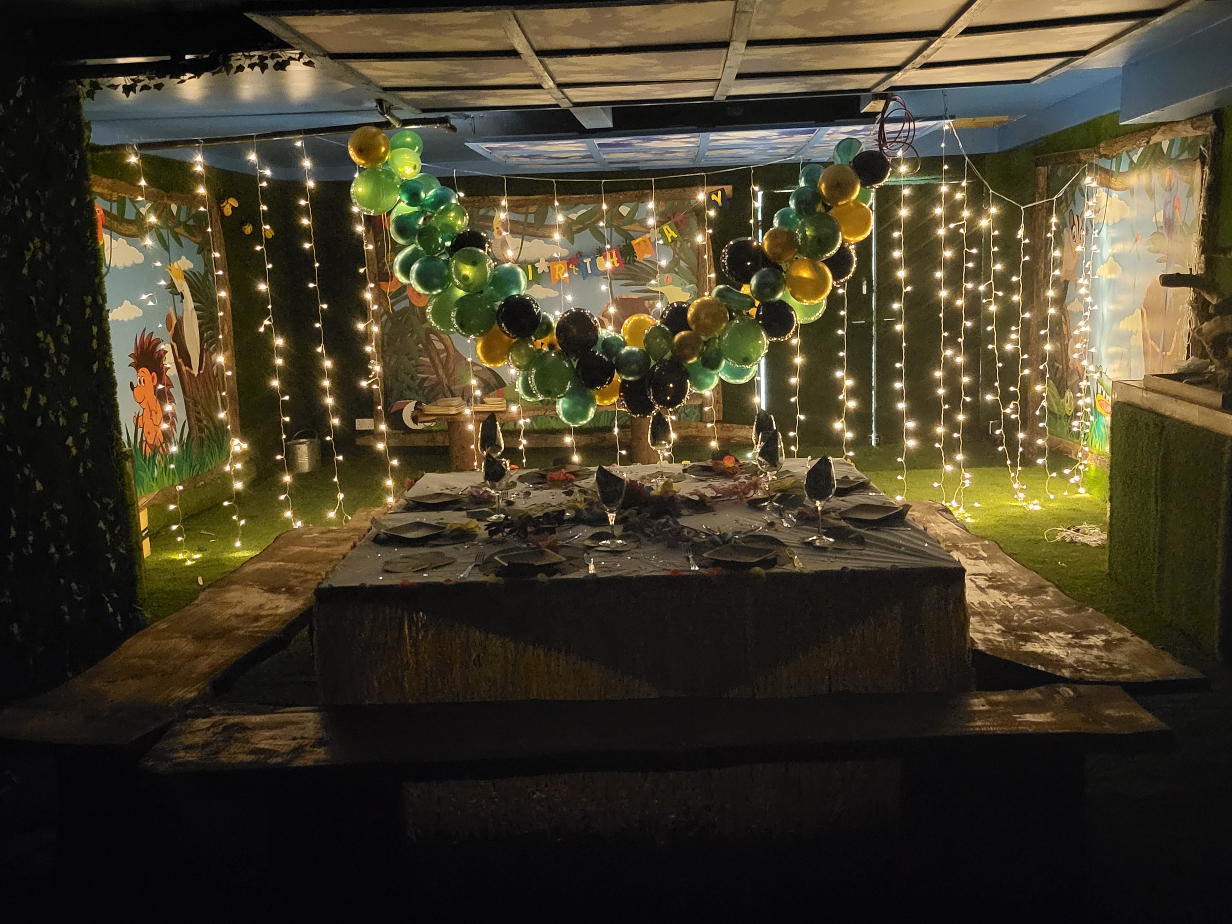 Vibrant balloon arch in The Party Cave event space for intimate celebrations.