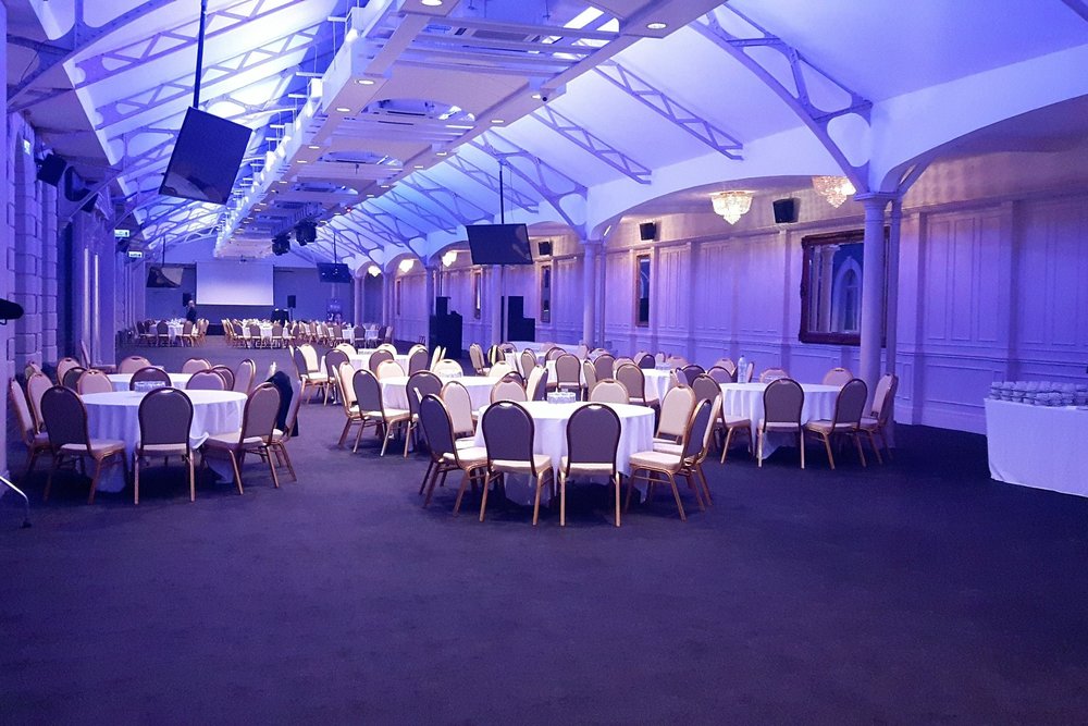 Grand Station Conference Venue with elegant round tables for formal events and weddings.