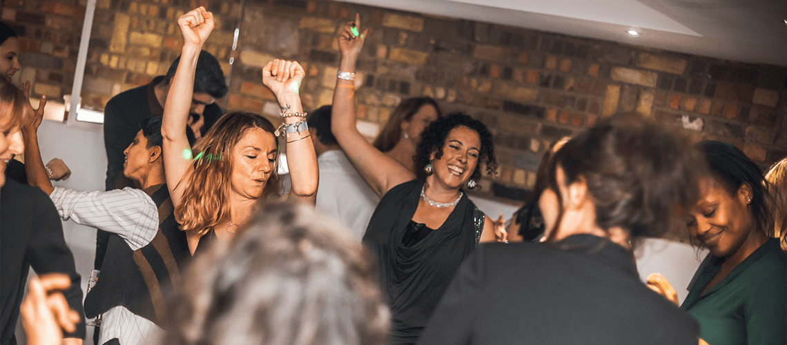Vibrant dance floor at 2010 Club event in Selhurst Park, showcasing celebration and inclusivity.