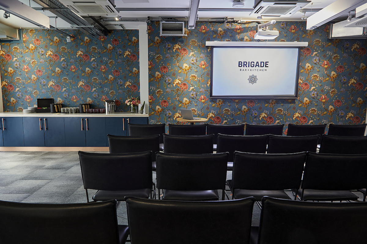 Covent Garden meeting space with floral wallpaper, ideal for presentations and brainstorming.