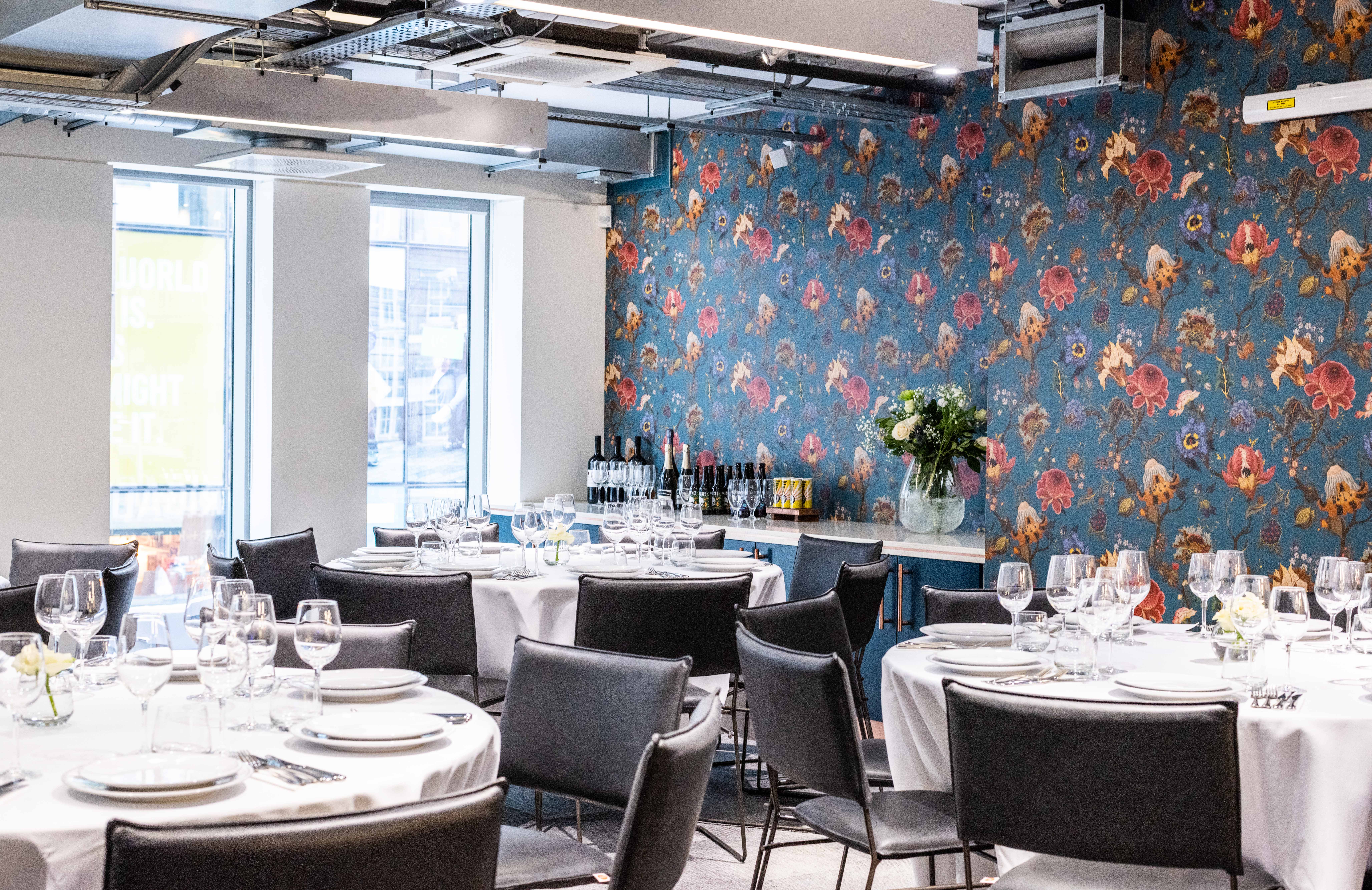 Elegant Covent Garden event space with round tables, perfect for meetings and receptions.