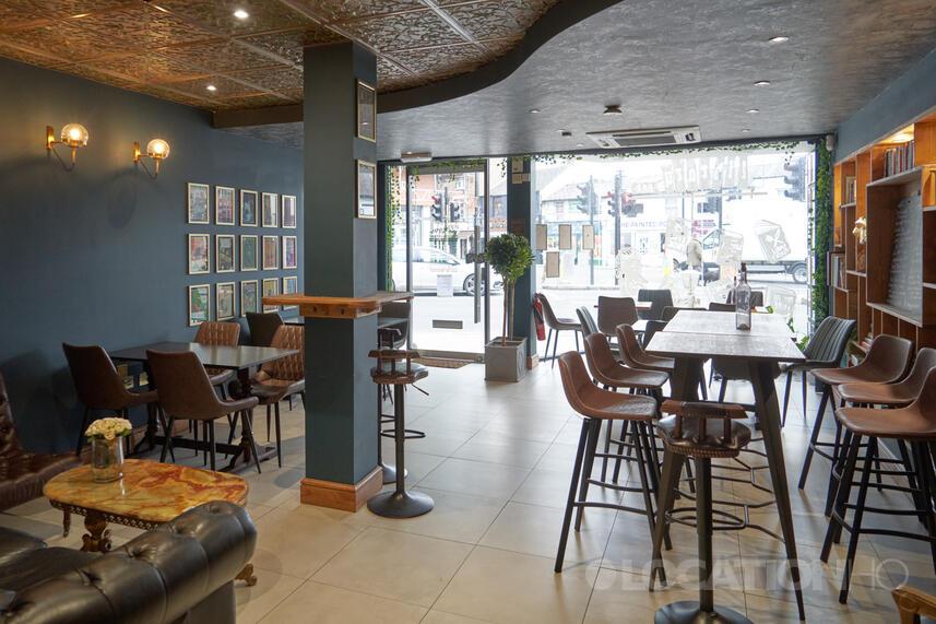 Literary Cocktail Coffee Bar event space with cozy seating for networking and meetings.