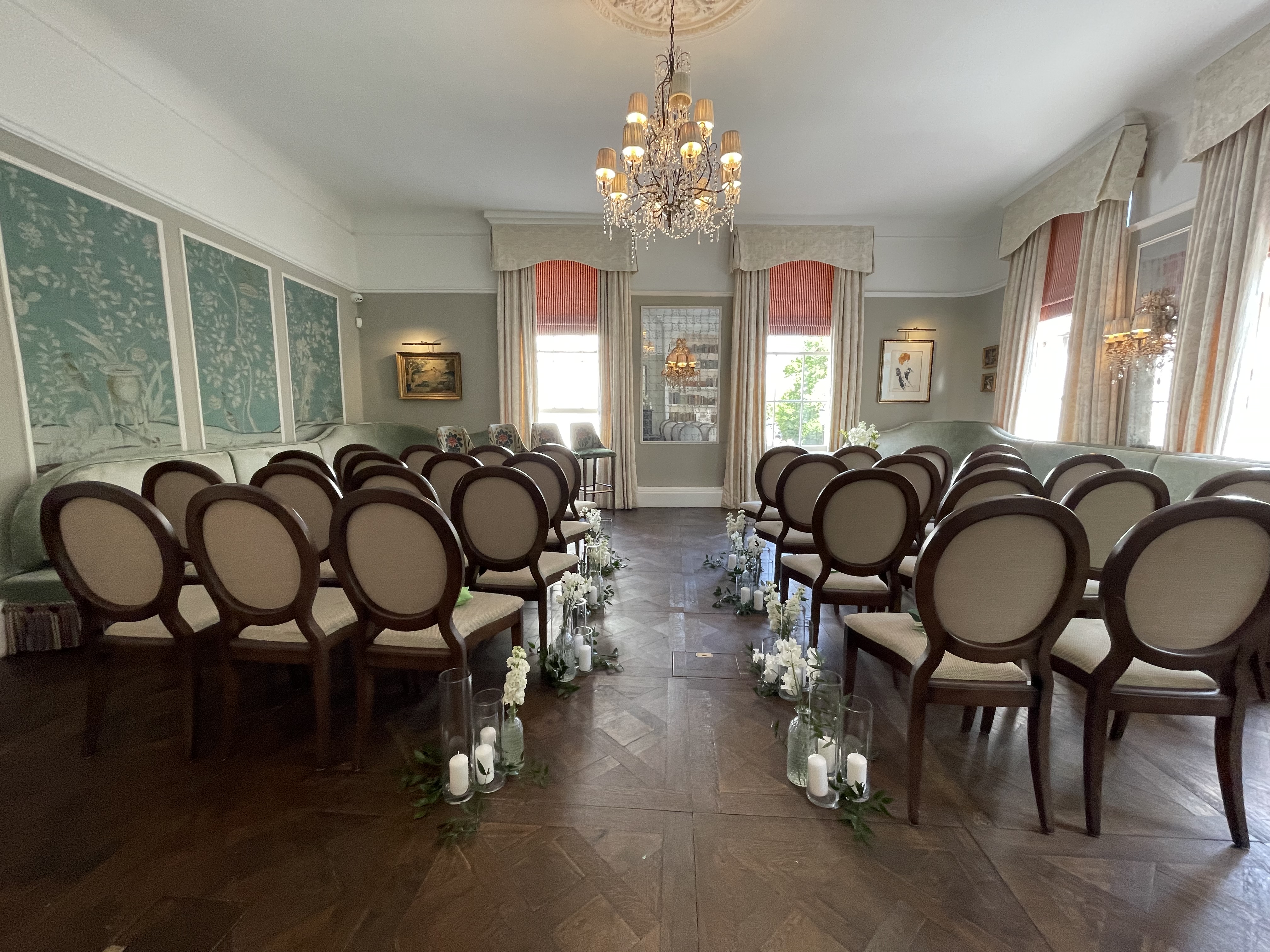 Elegant meeting space with floral decor, perfect for intimate gatherings and ceremonies.