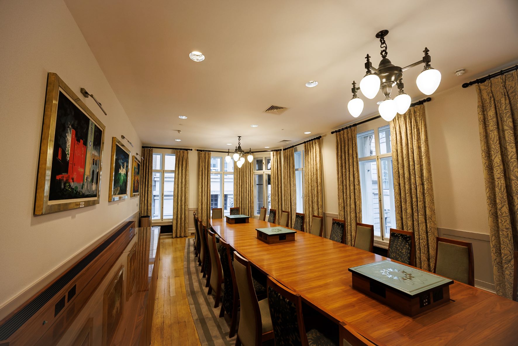 Boardroom at One Moorgate Place with wooden table, ideal for professional meetings and events.