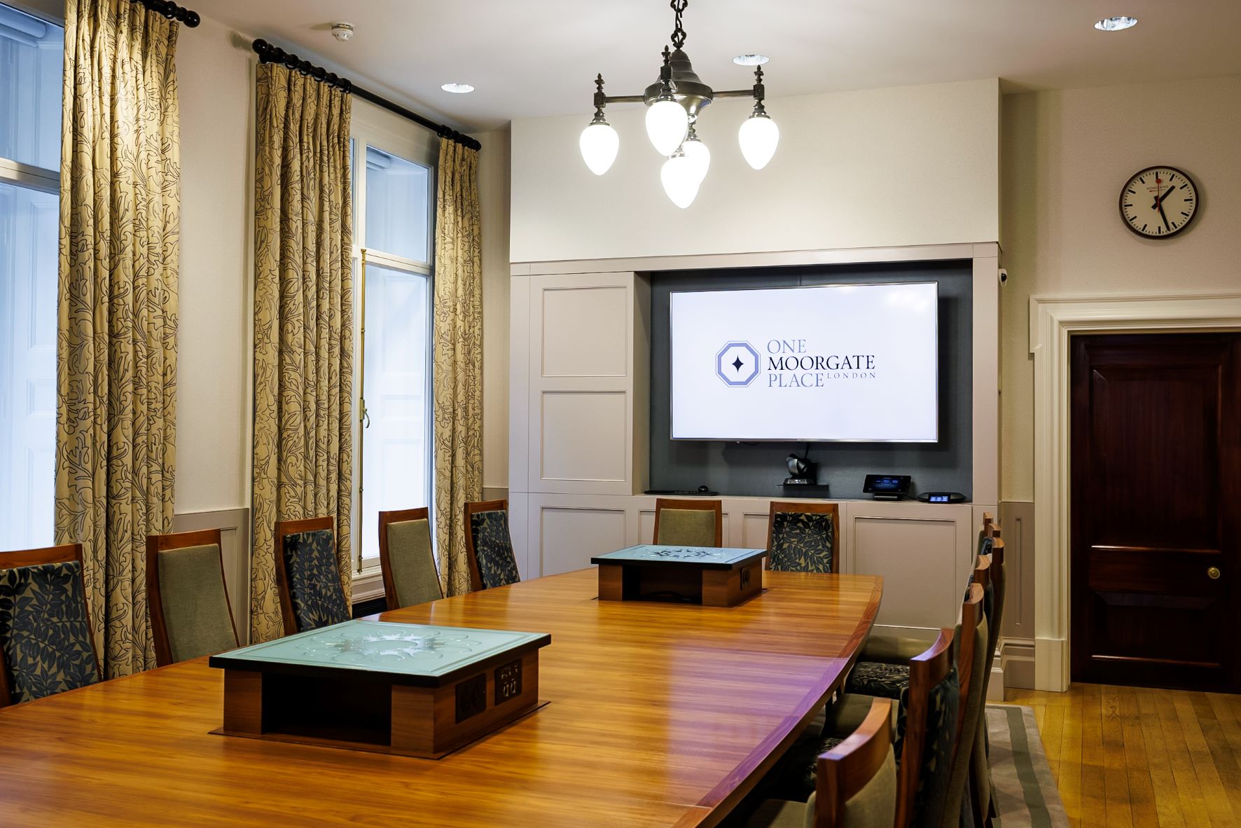 Boardroom at One Moorgate Place with elegant wooden table for corporate meetings.