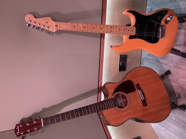 Guitars in creative space at Rollover Studios for events and collaboration.