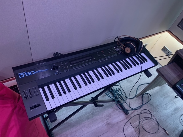 Keyboard setup with headphones for live events and creative sessions at Rollover Studios.