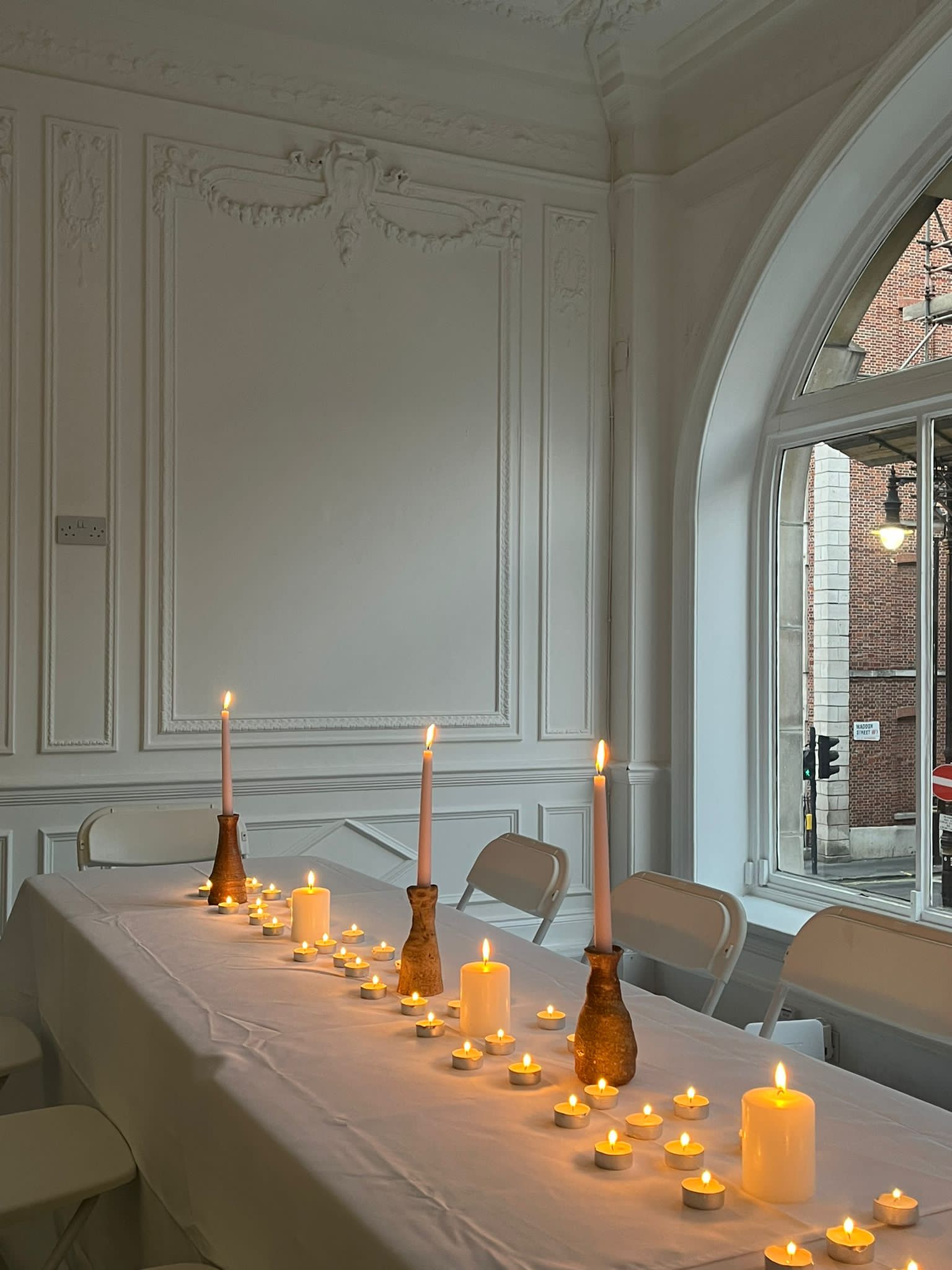 Elegant table setting with candlelight on Saint George Street for intimate events.