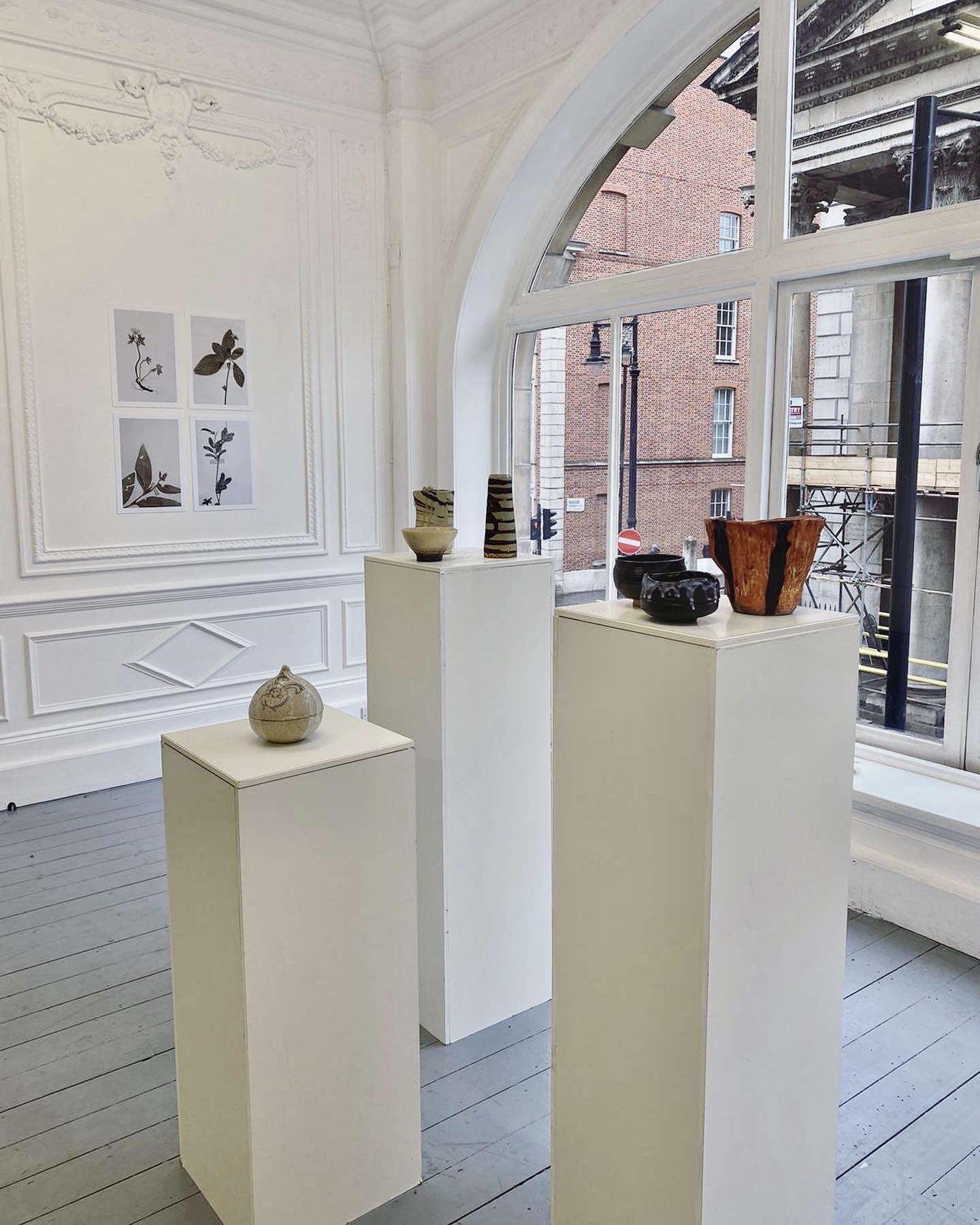 Minimalist exhibition space on Saint George Street with ceramic artworks, ideal for art events.