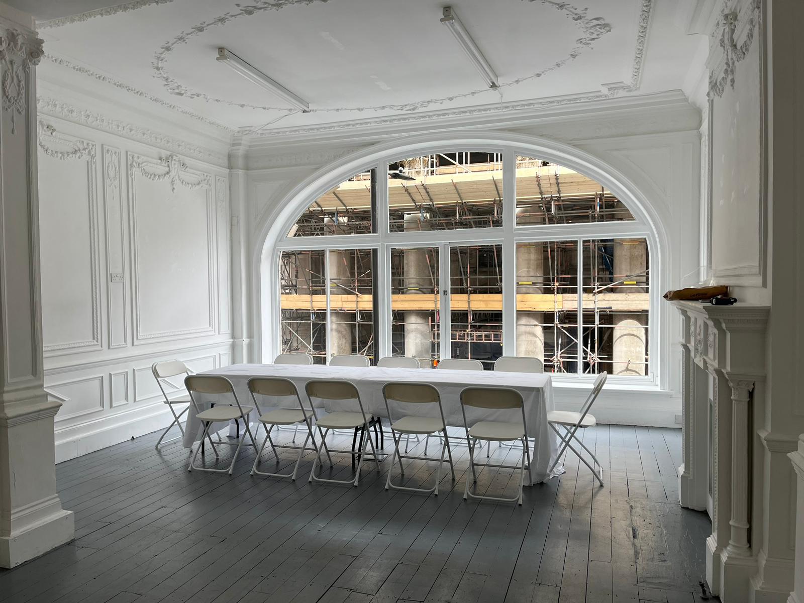 Elegant meeting space on Saint George Street with large windows, ideal for gatherings.