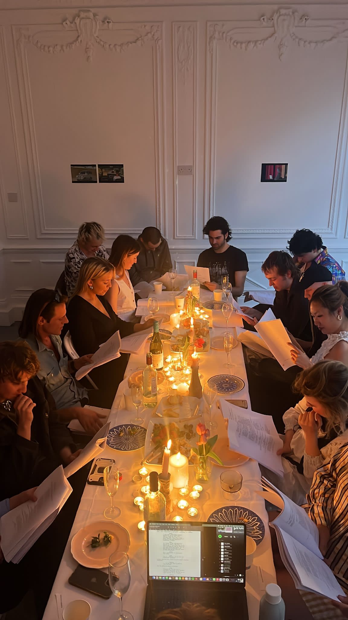 Group brainstorming session in candlelit Saint George Street setting.