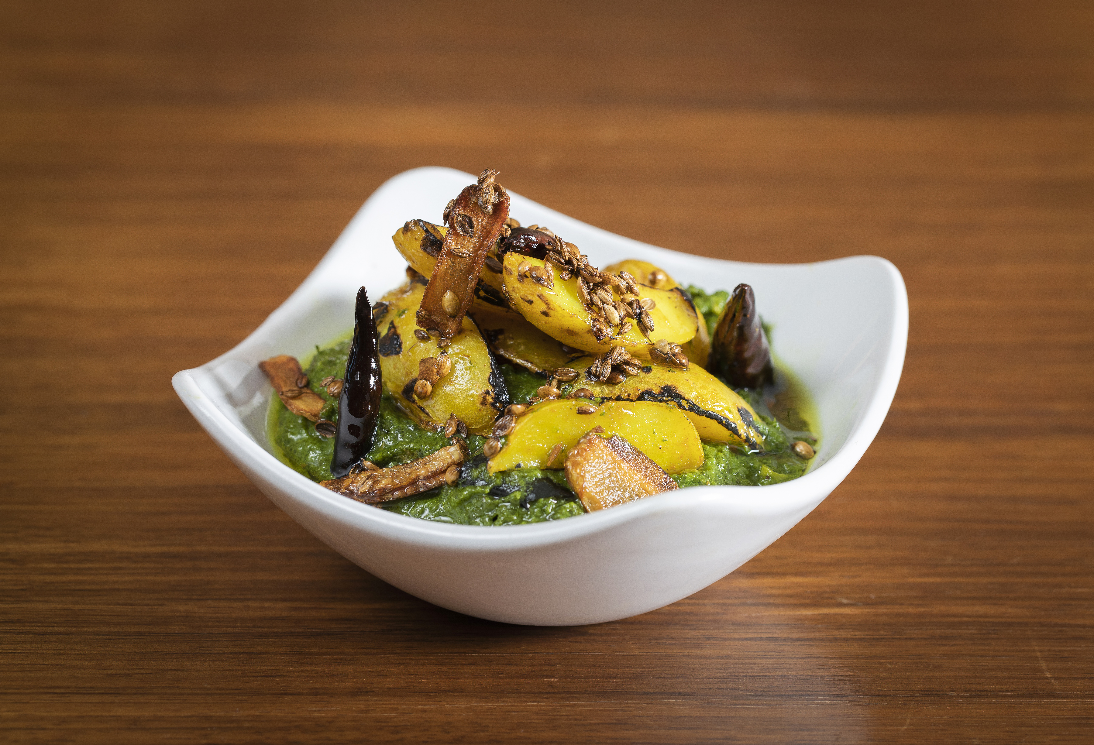 Vibrant sautéed greens dish for event catering, ideal for gourmet buffets and themed events.