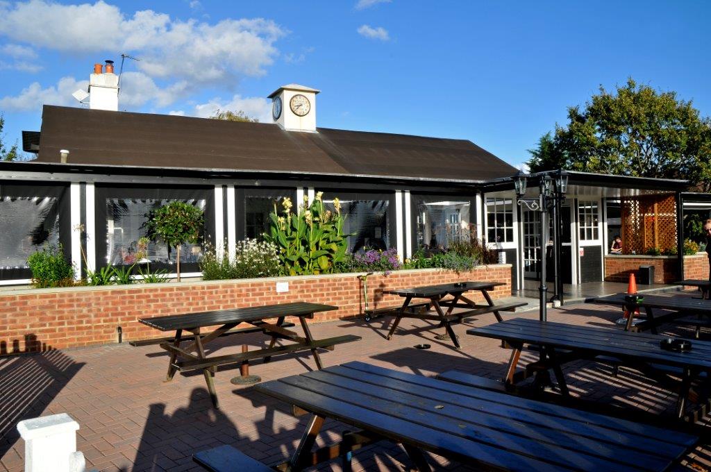 Charming outdoor venue at Woodies Freehouse with spacious patio for events.