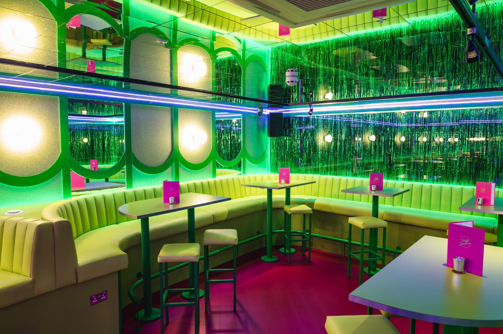 Vibrant event space at Tonight Josephine Bristol with neon colors for casual gatherings.