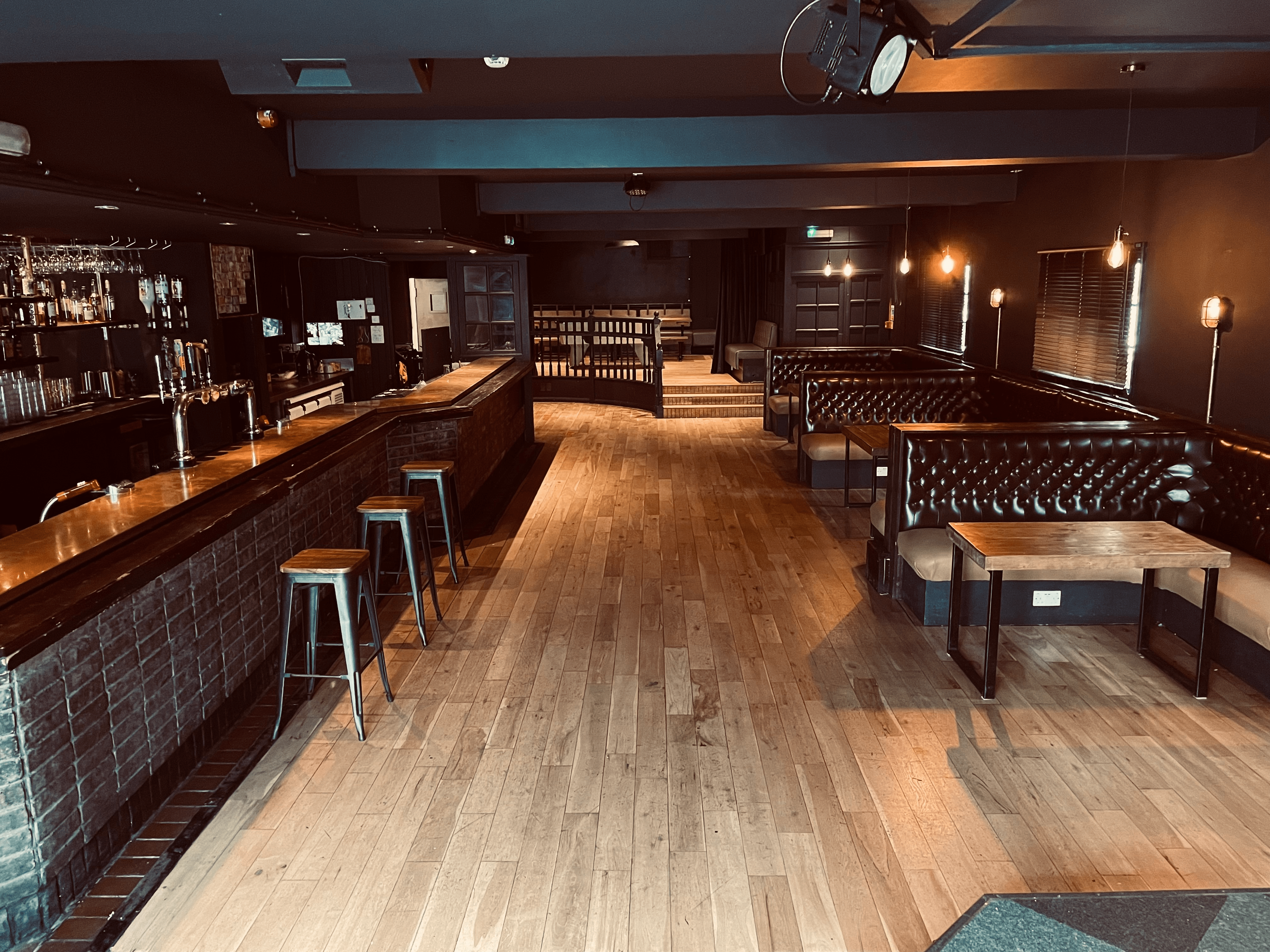 Versatile event space with sleek bar, ideal for cocktail receptions and private parties.