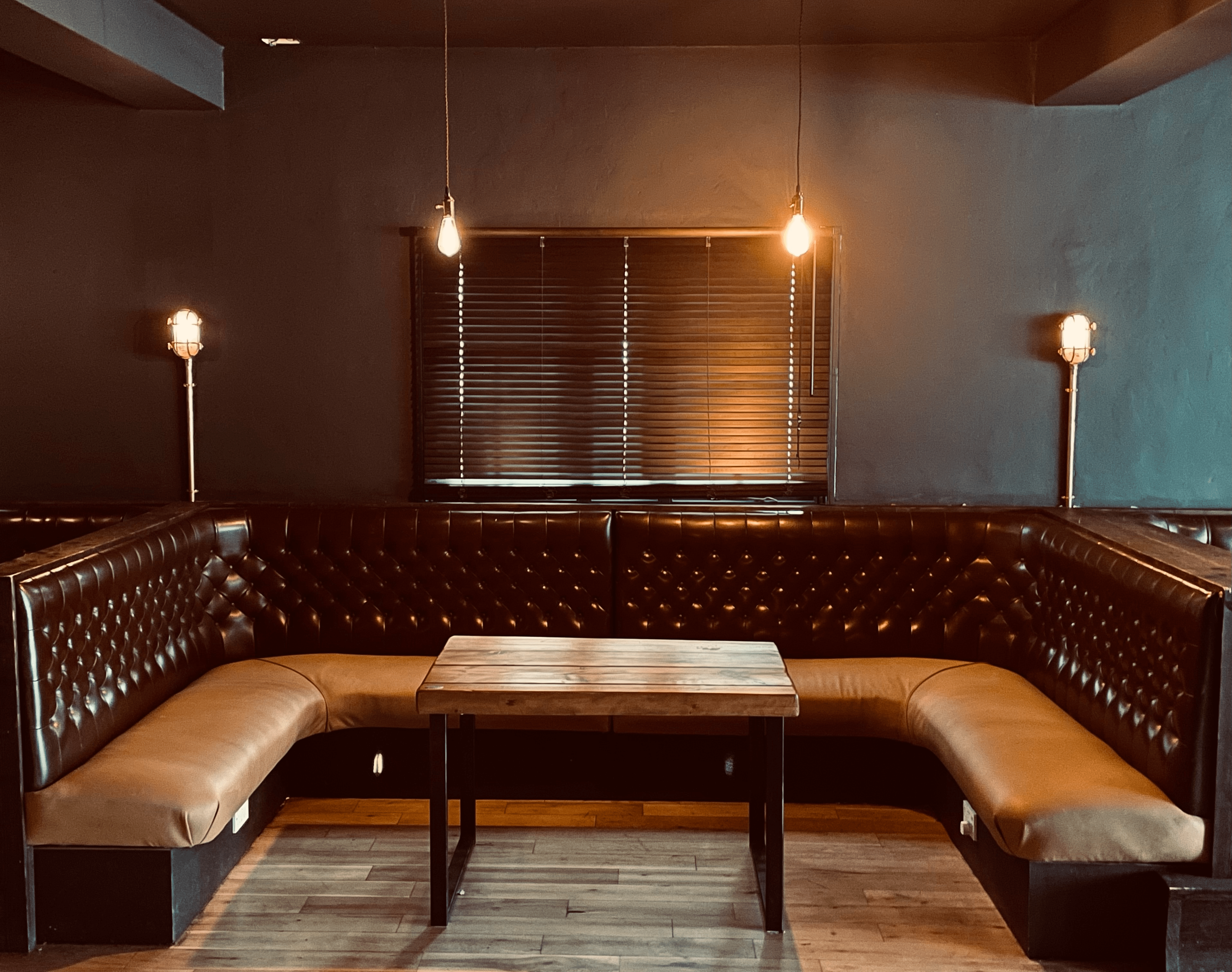 Stylish leather booth in cozy seating area for networking events and meetings.
