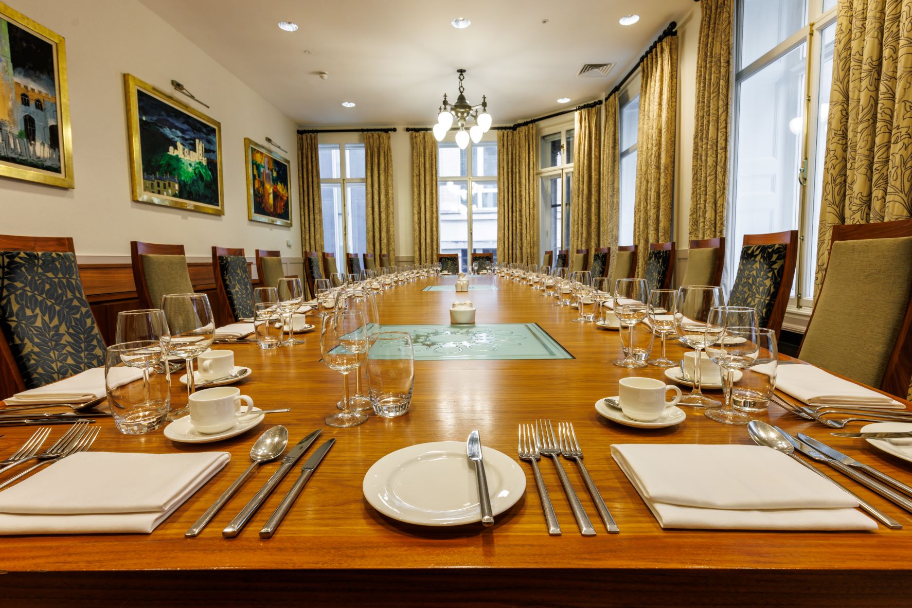 Boardroom at One Moorgate Place with elegant wooden table, ideal for meetings and events.