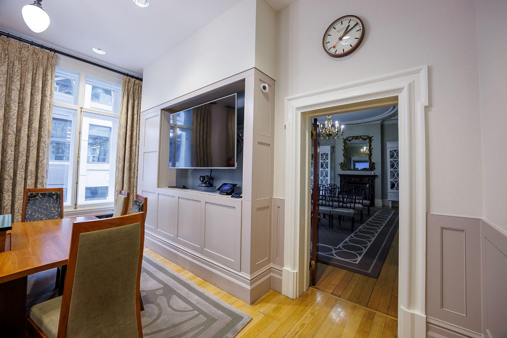Boardroom at One Moorgate Place with wooden table, ideal for meetings and presentations.