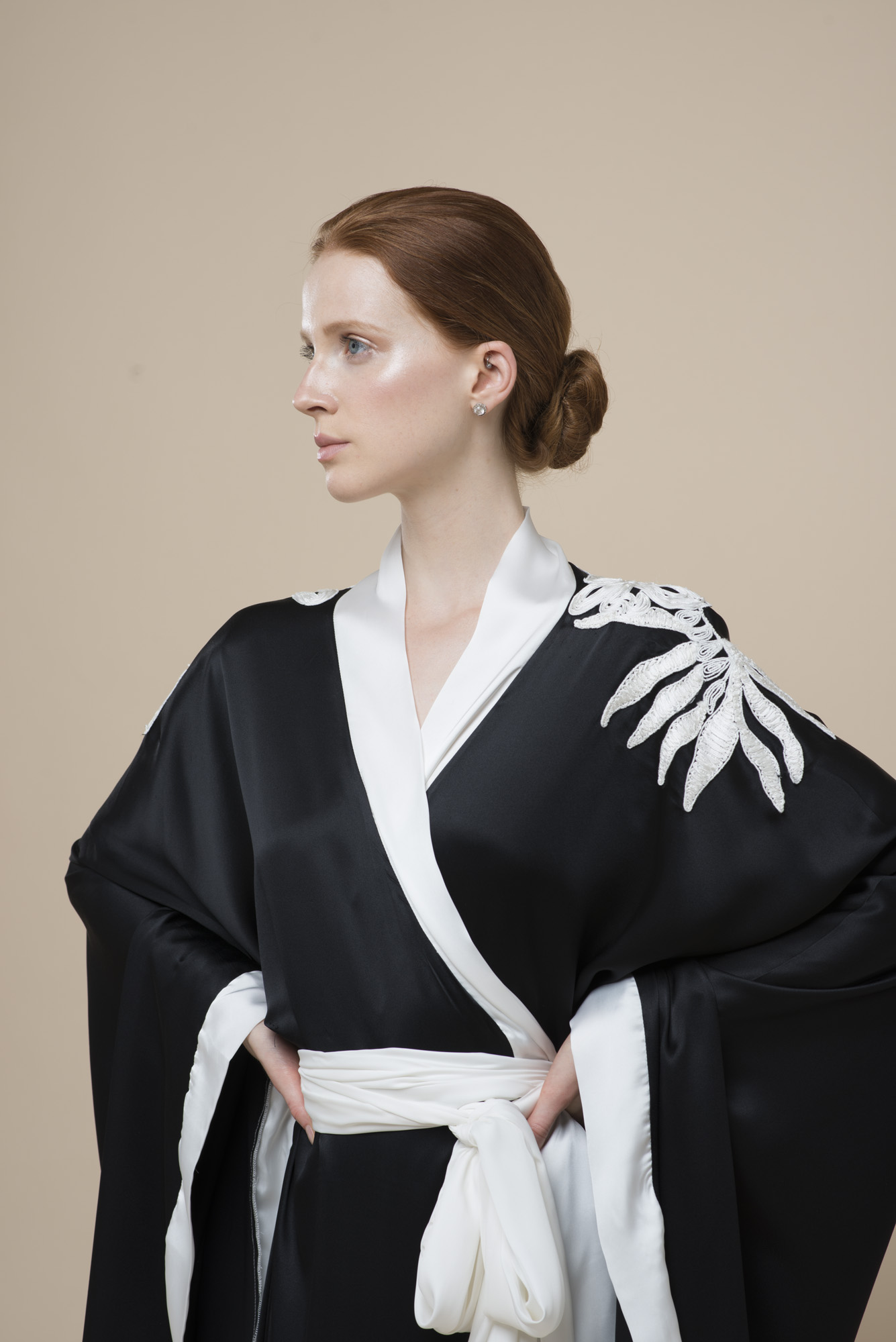 Poised professional with elegant hairstyle in West London Studio for events branding.