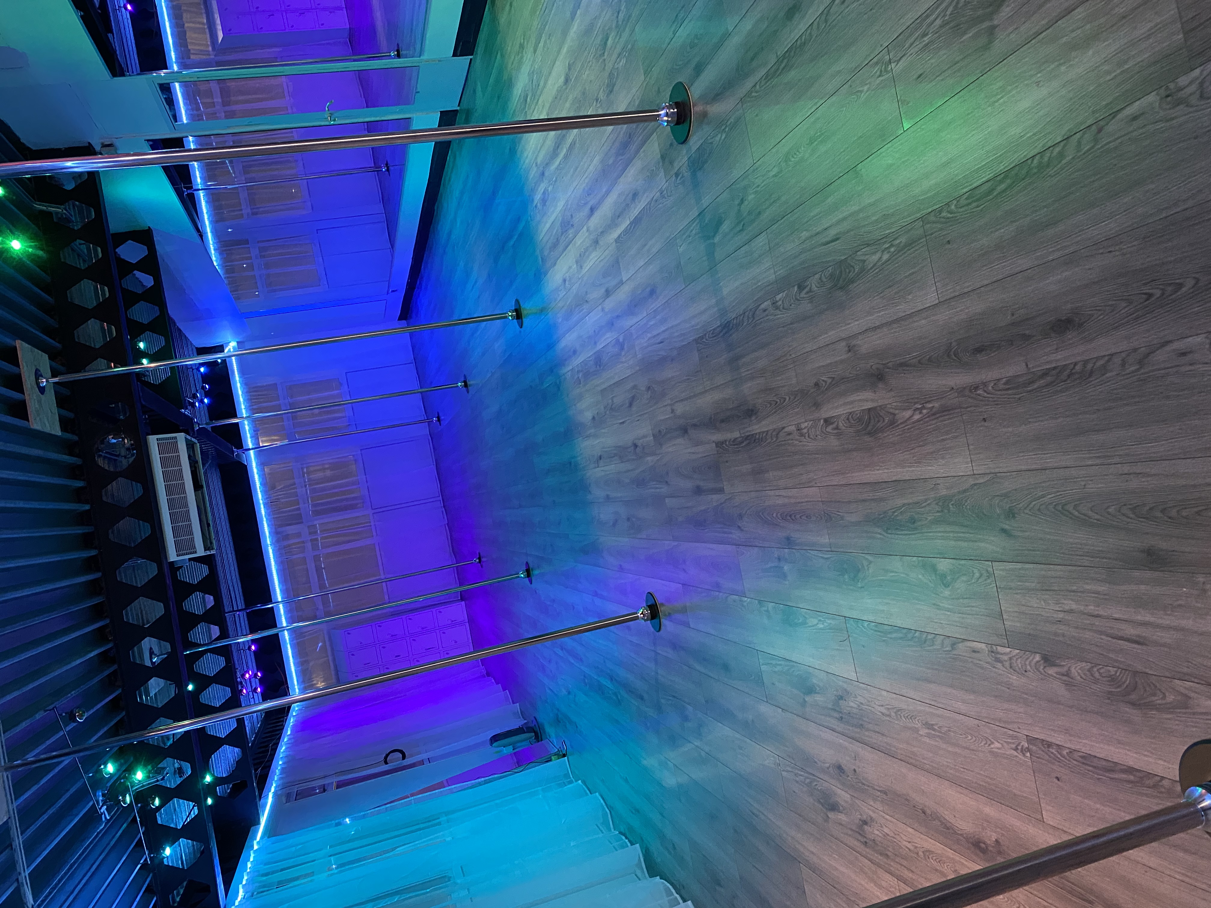 Versatile event space with wooden flooring for fitness and dance activities in Guildford.