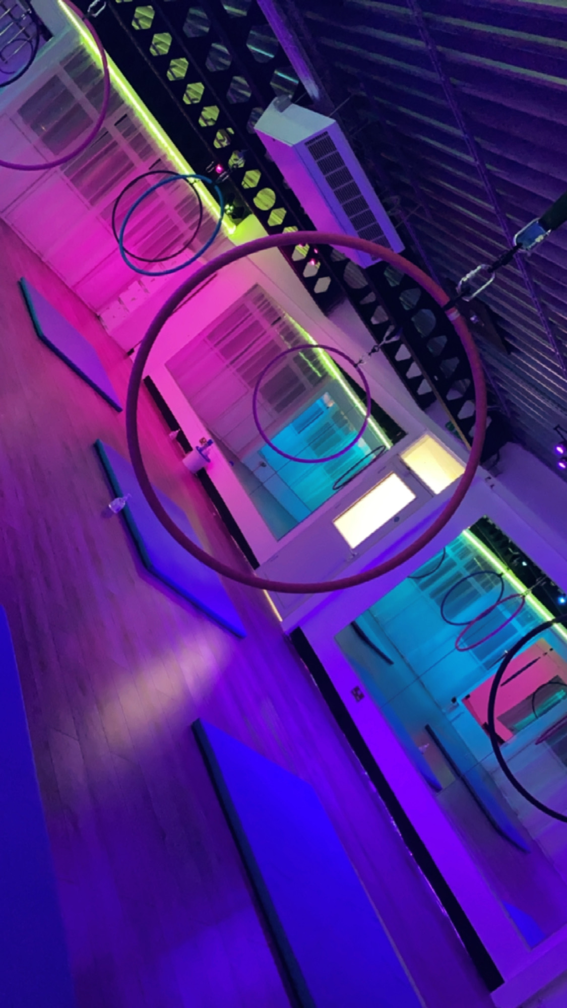 Vibrant event space with aerial hoops for creative workshops and performances in Guildford.