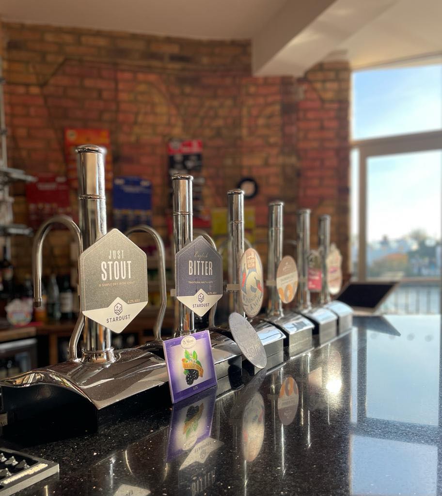 Main Bar at Last Hop with craft beer taps, perfect for networking events and gatherings.