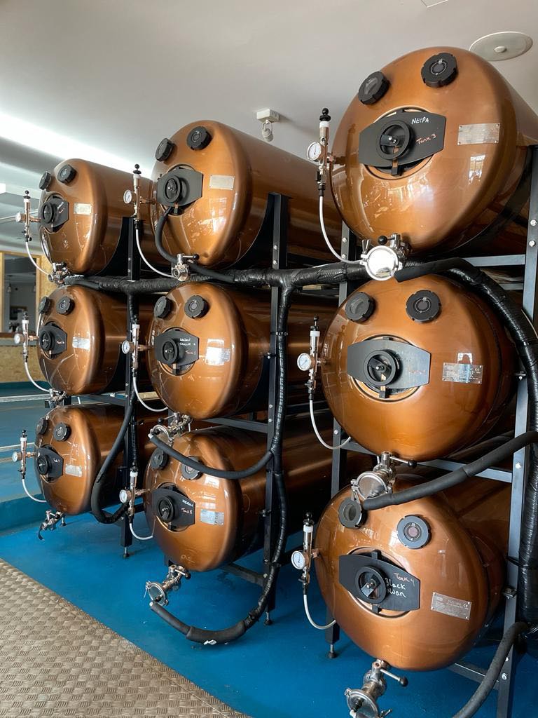 Cylindrical tanks at Main Bar, Last Hop; unique venue for wellness retreats and conferences.