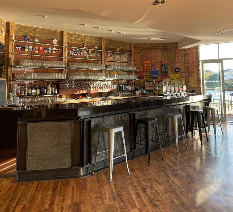 Main Bar at Last Hop: sleek counter, ideal for networking events and social gatherings.
