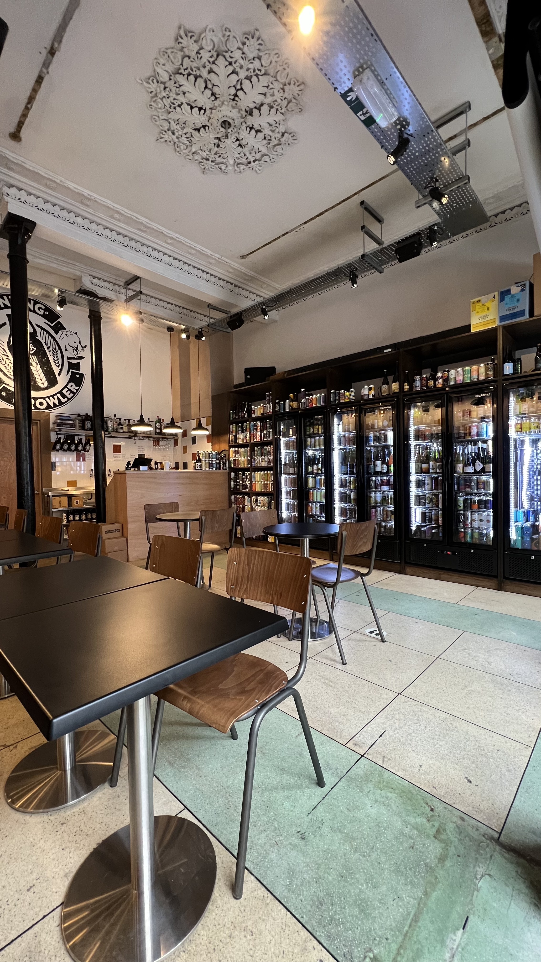 Cozy Grunting Growler venue with sleek bar, ideal for informal meetings and small events.