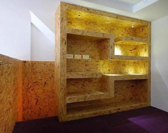 Modern wood panel display wall at Doreen's Coffee House for events and branding.