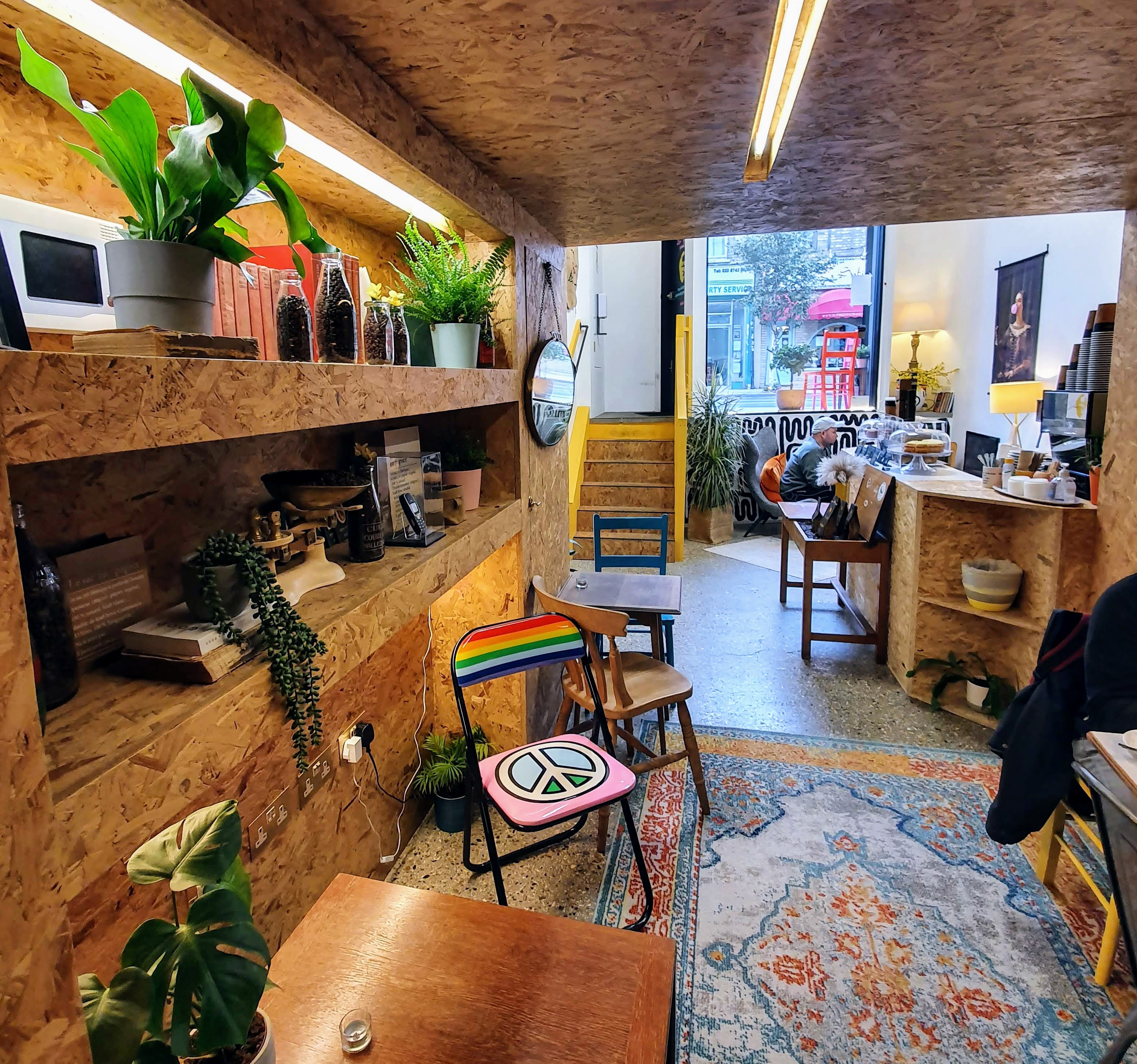 Cozy Doreen's Coffee House with warm wood accents, ideal for meetings and events.