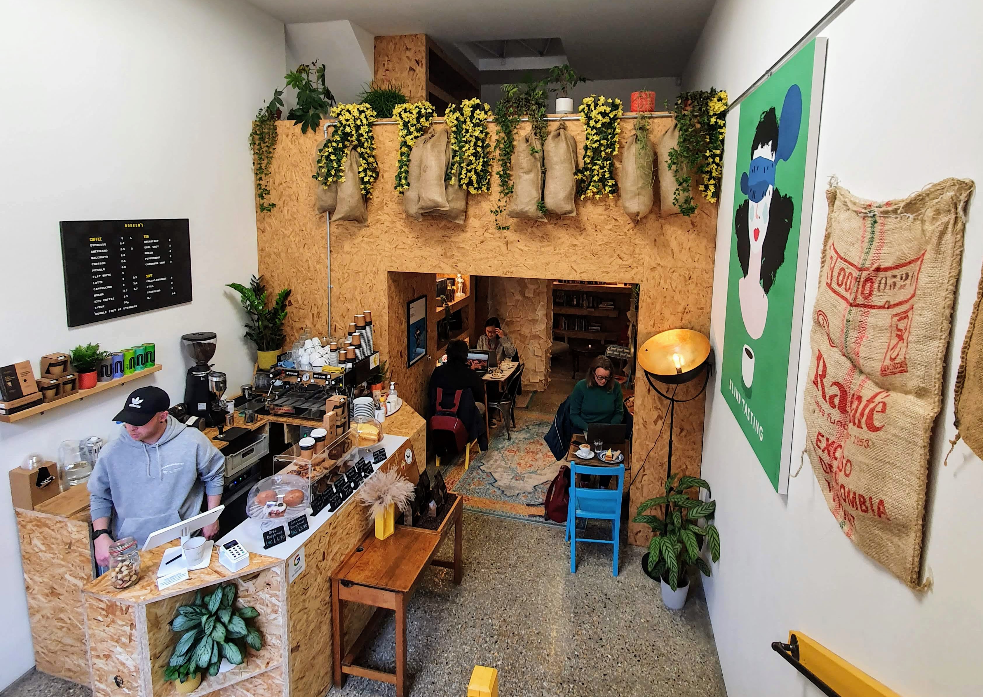 Cozy Doreen's Coffee House with wood accents, ideal for casual meetings and networking.