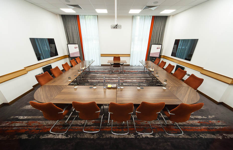 Meeting room 7 at Clayton Hotel Leeds with oval table, ideal for workshops and meetings.