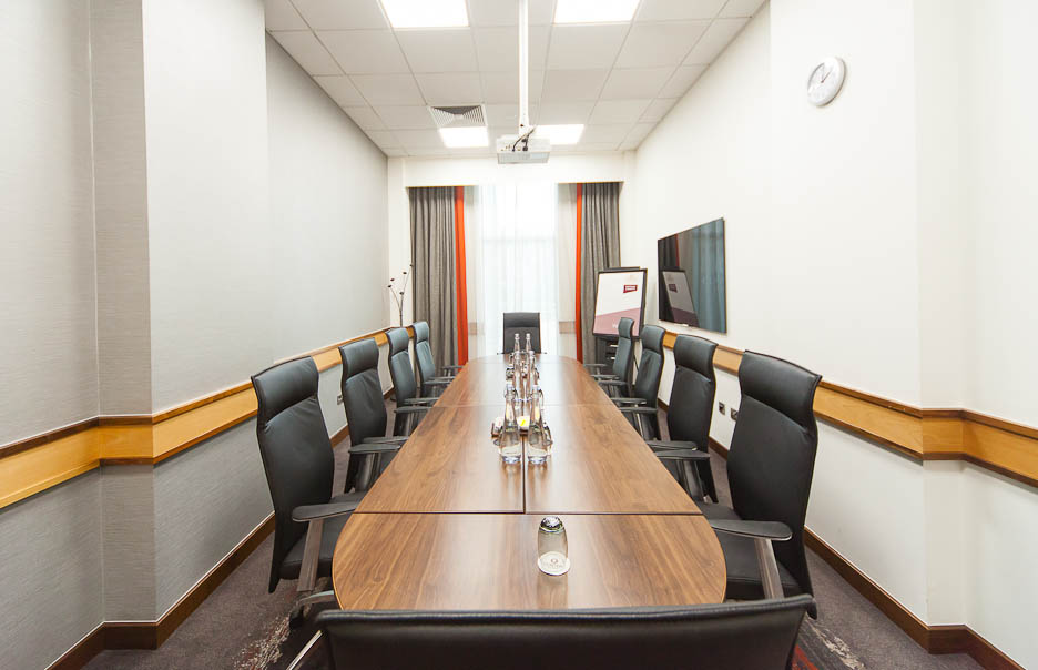 Meeting room 1 at Clayton Hotel Leeds with a long wooden table for professional events.