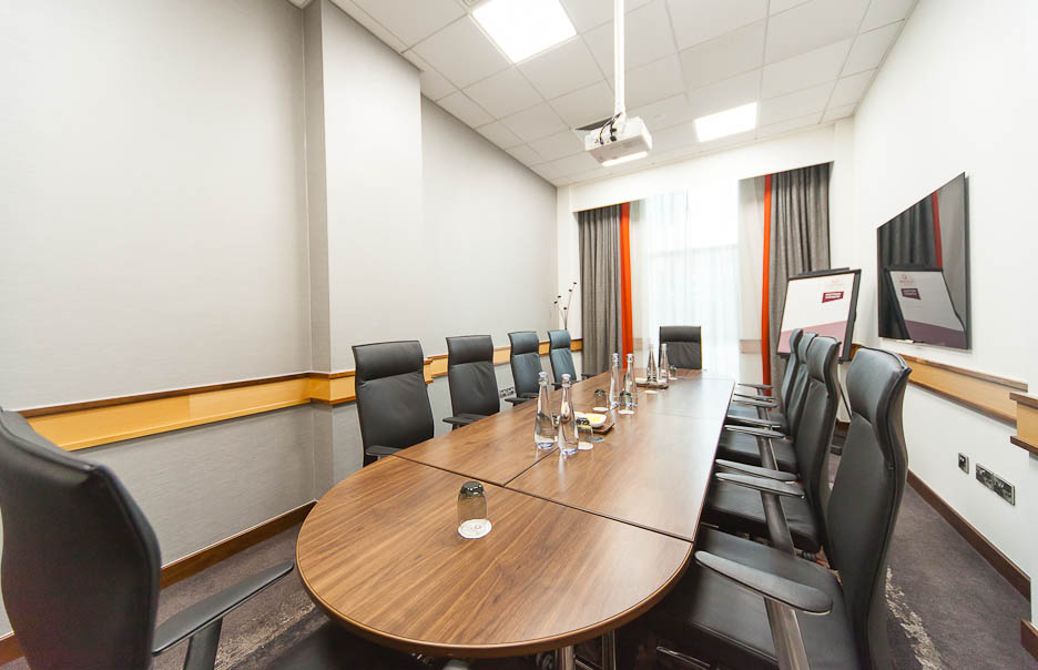 Meeting room 1 at Clayton Hotel Leeds with oval table, ideal for professional events.