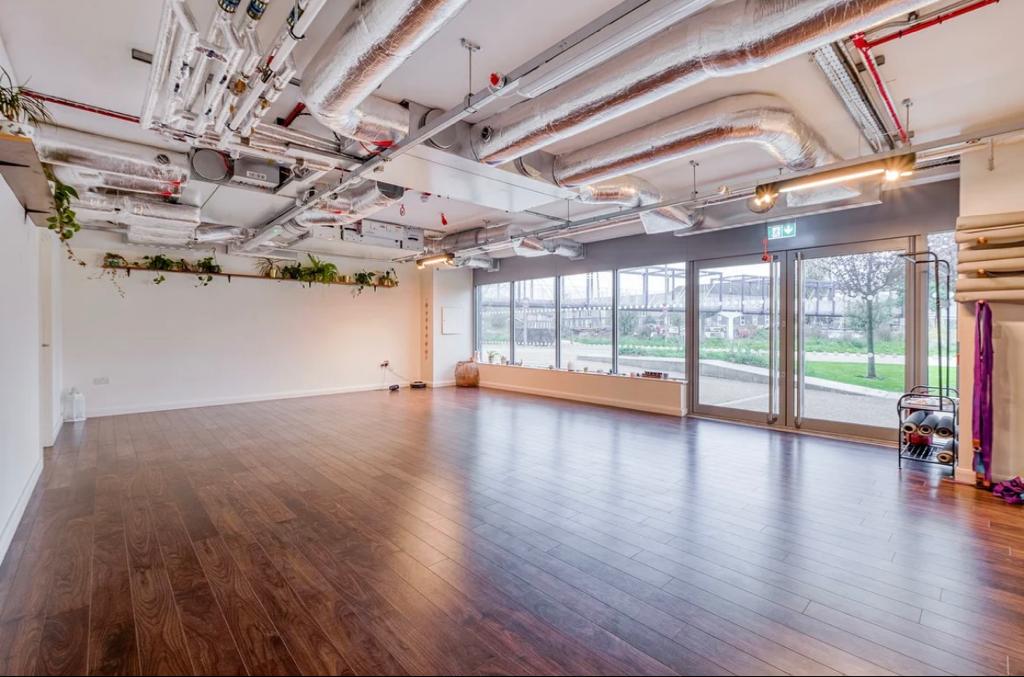 Aura Organics Spa: modern event space with natural light for workshops and fitness classes.