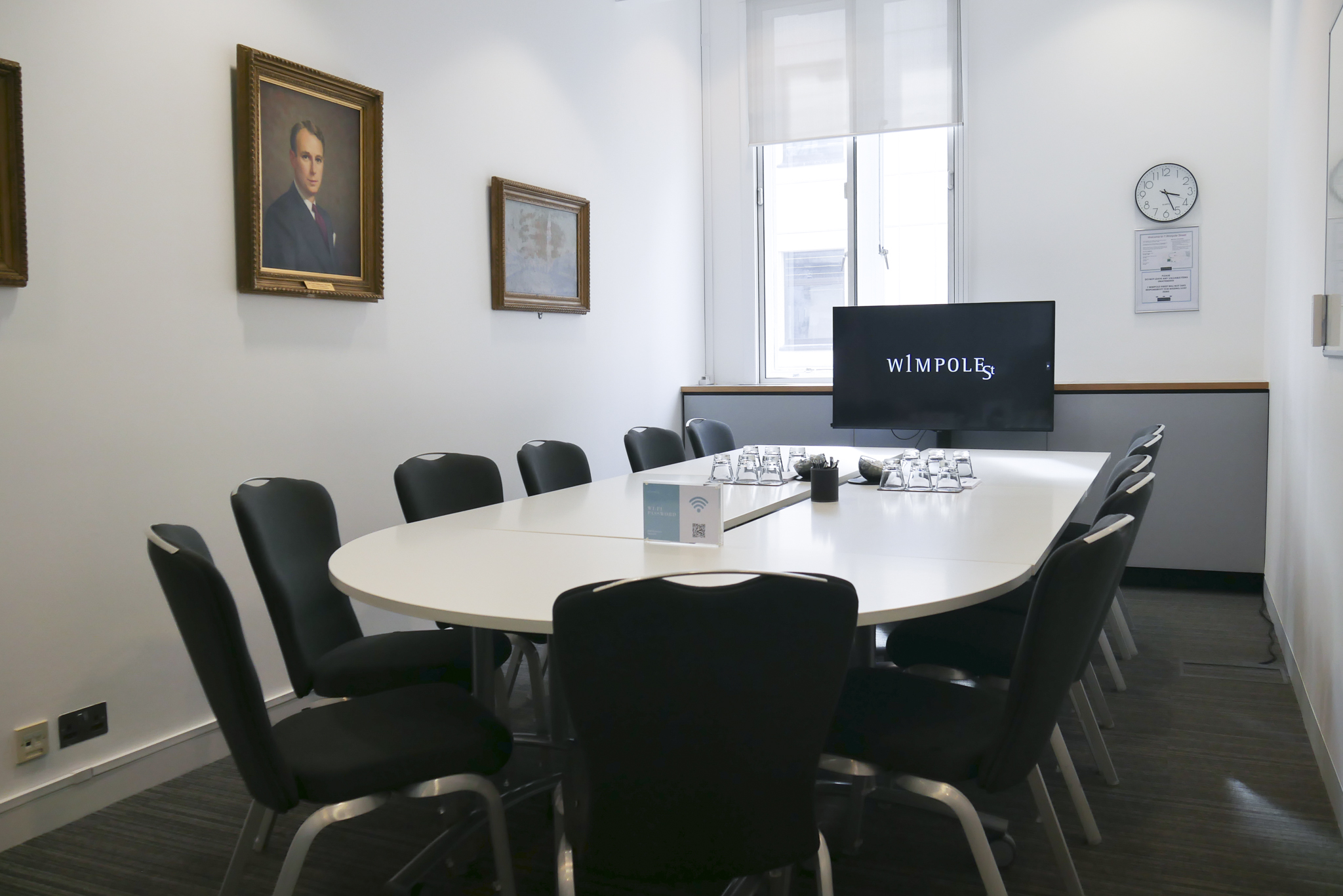 Modern Library Boardroom with oval table, ideal for professional meetings and presentations.