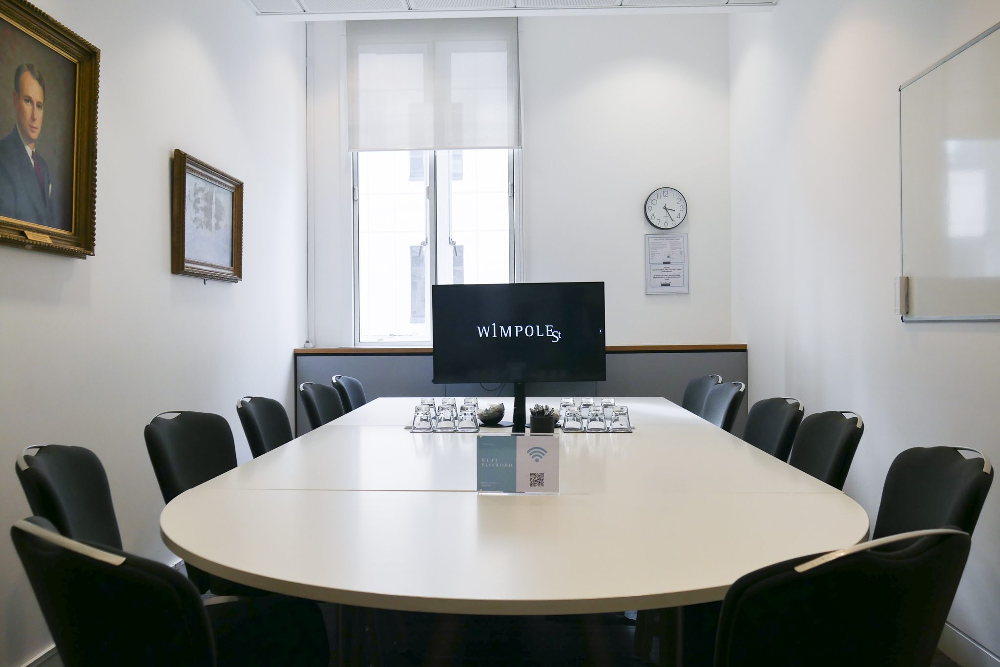 Modern Library Boardroom with oval table, ideal for meetings and presentations.