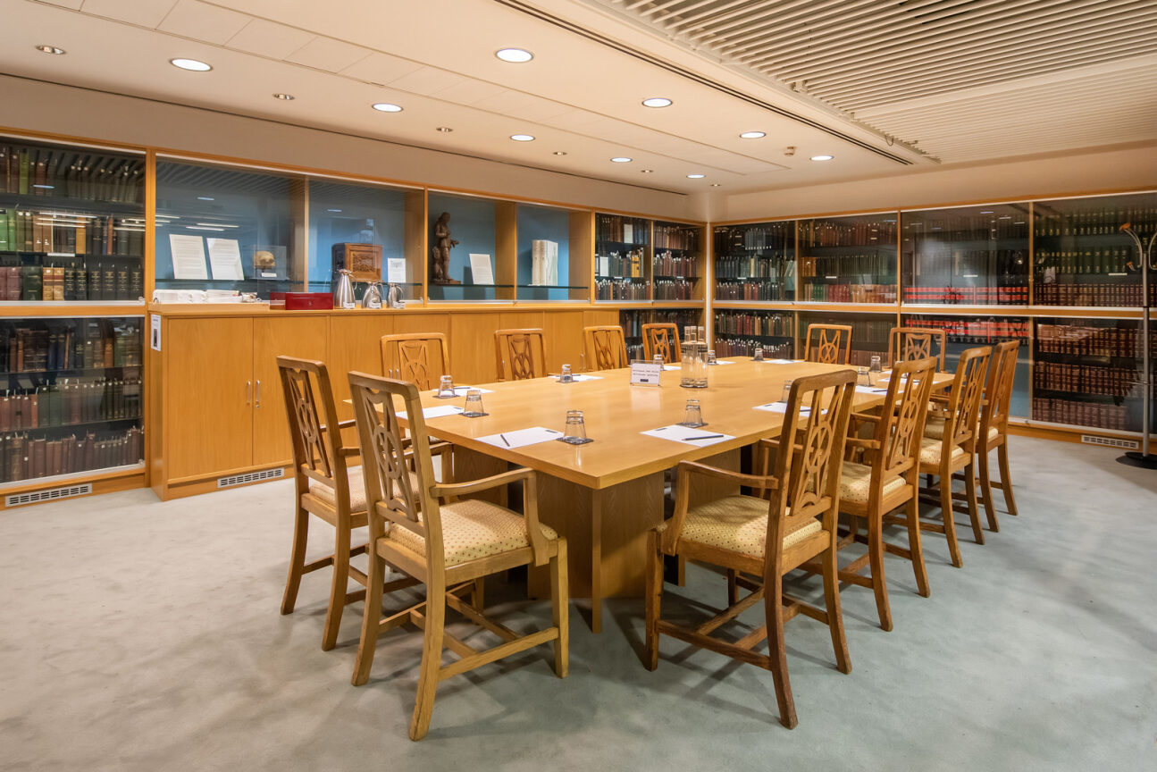 Heritage Centre meeting room with wooden table, ideal for intimate gatherings and board meetings.