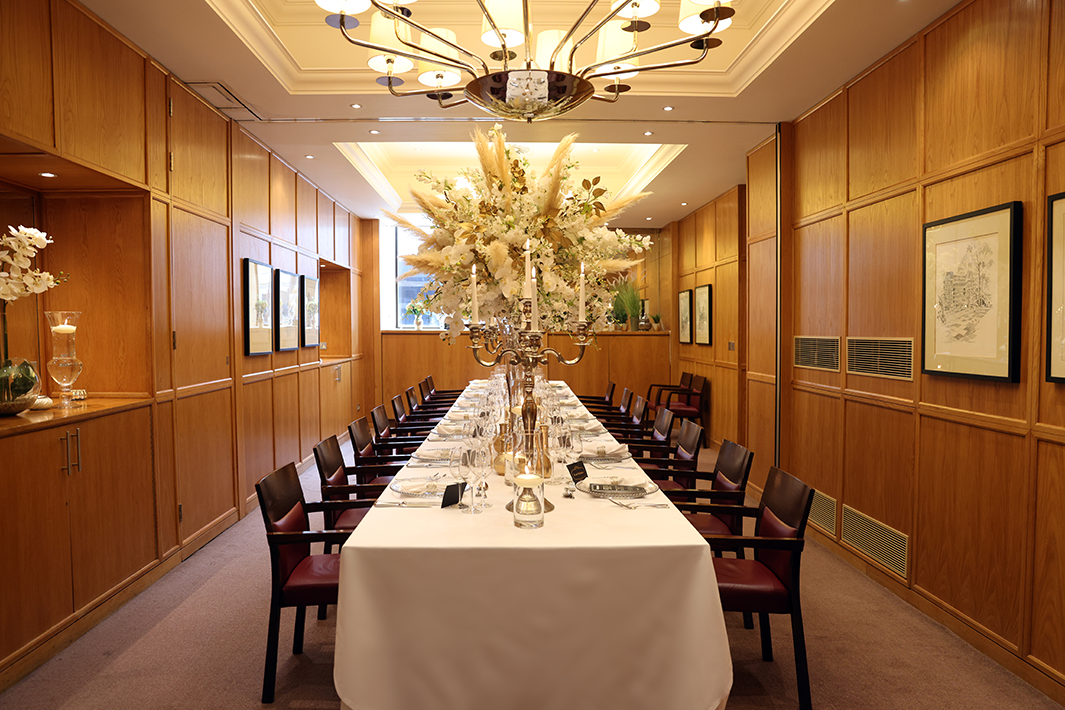 Elegant private dining room with floral centerpieces for sophisticated events.
