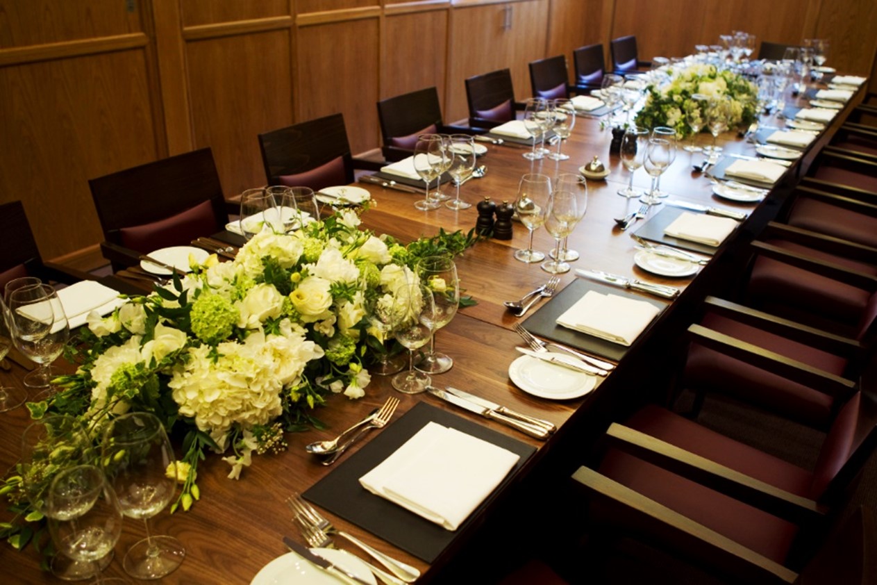 Elegant boardroom table with floral centerpiece for upscale meetings at Wimpole Room.