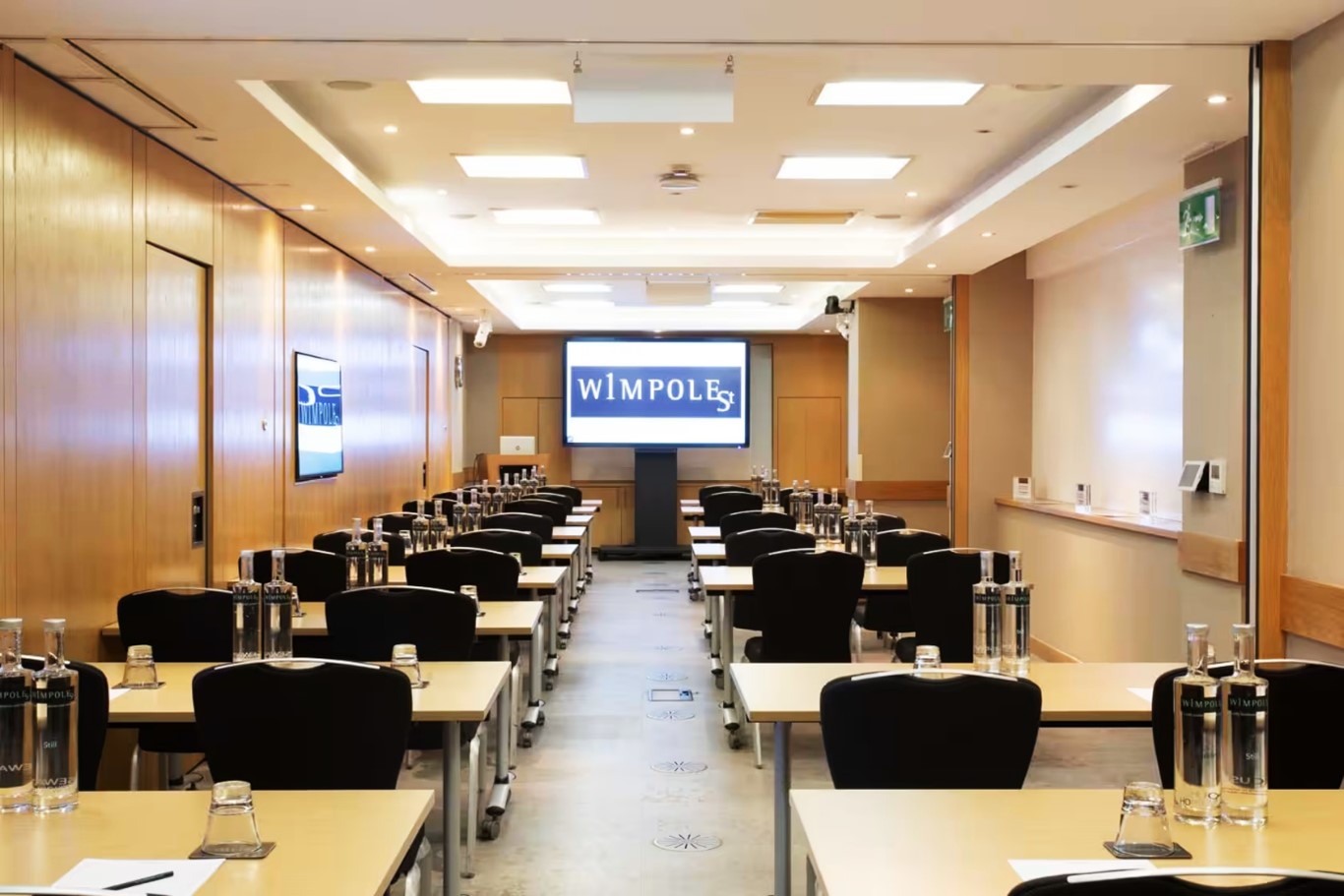 Seminar Suite at 1 Wimpole Street, modern meeting room with large screen for workshops.