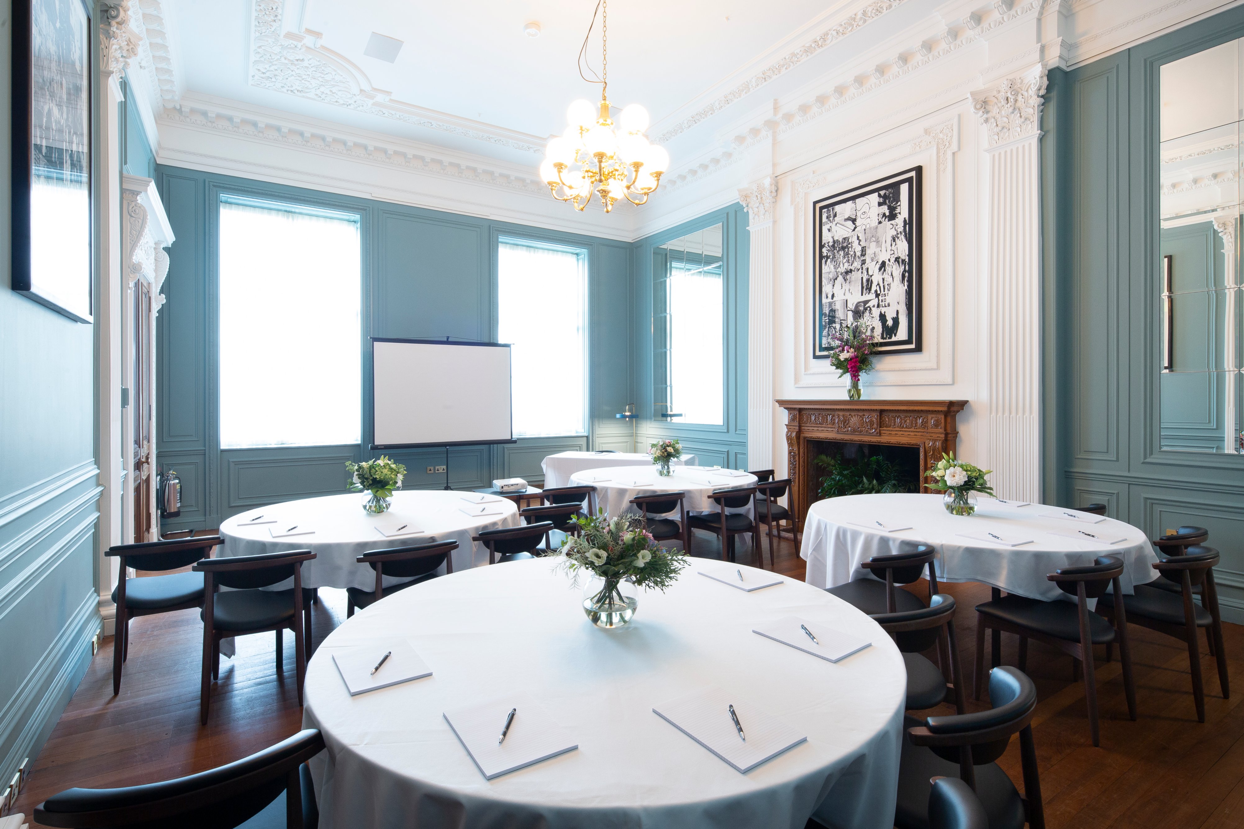Elegant meeting room with round tables for workshops at Cheval The Edinburgh Grand.