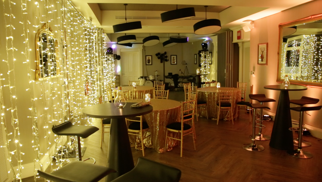 Elegant event space with fairy lights, ideal for intimate gatherings and cocktail receptions.