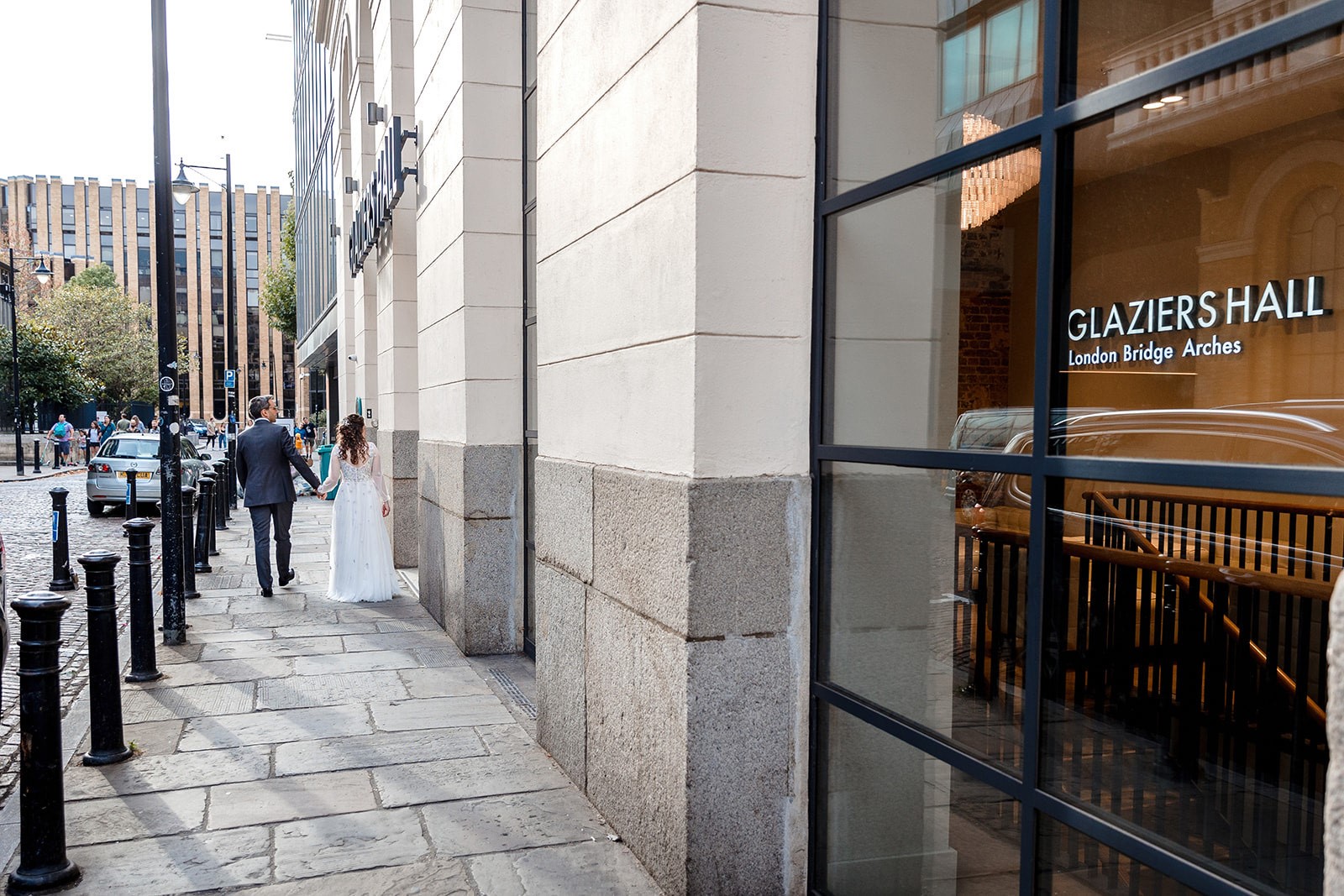 Couple approaching elegant Glaziers Hall, ideal venue for weddings and events.