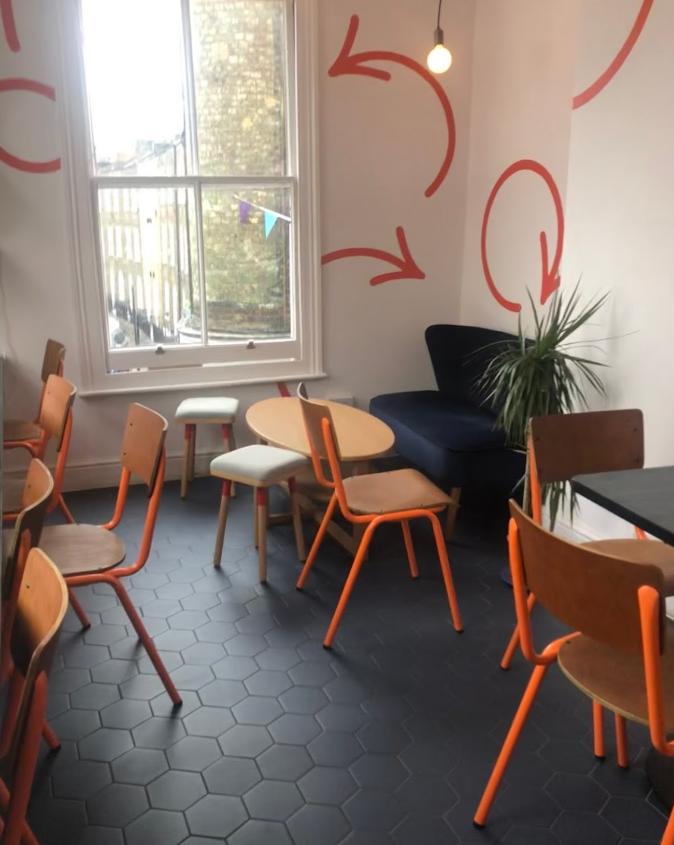 Cozy trampoline venue with colorful seating for creative meetings and brainstorming sessions.